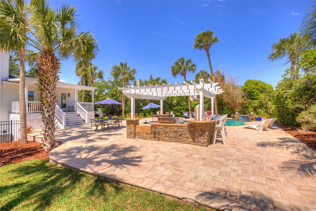 105 Riverside Drive Ormond Beach, FL 32176 - Photo 87 of 100 a view of a swimming pool with a patio