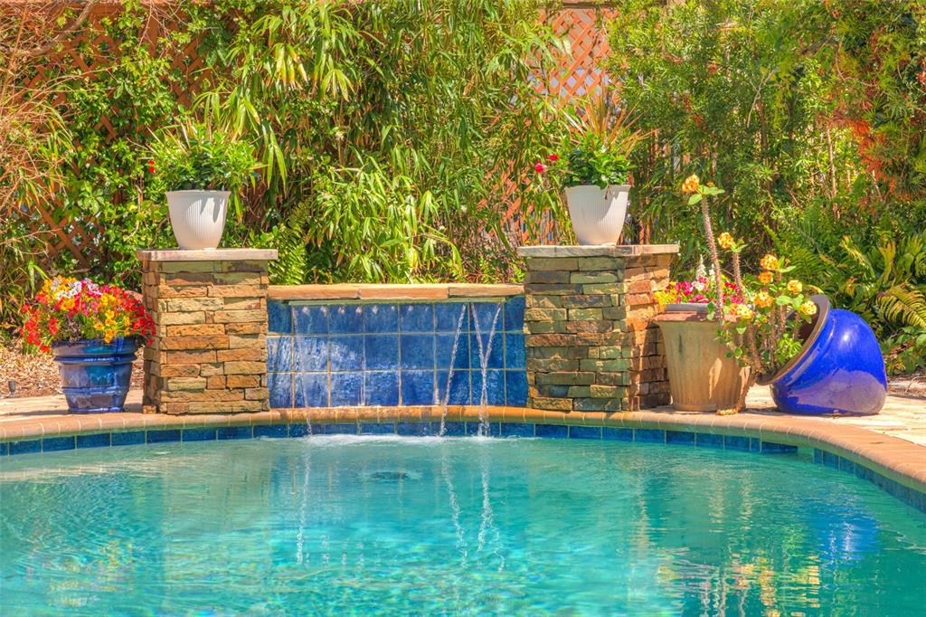 105 Riverside Drive Ormond Beach, FL 32176 - Photo 92 of 100 a view of a backyard with wooden fence and a bench
