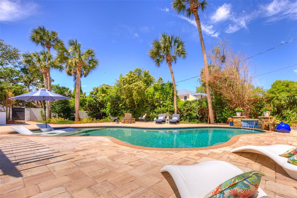105 Riverside Drive Ormond Beach, FL 32176 - Photo 94 of 100 a view of a swimming pool with a yard