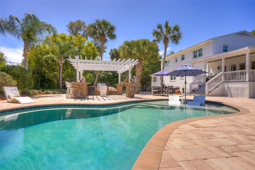 105 Riverside Drive Ormond Beach, FL 32176 - Photo 95 of 100 a view of a house with swimming pool having outdoor seating