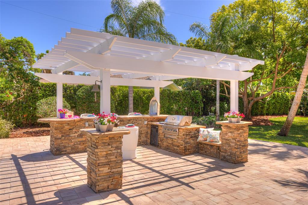 105 Riverside Drive Ormond Beach, FL 32176 - Photo 96 of 100 a patio with couches table and chairs and potted plants