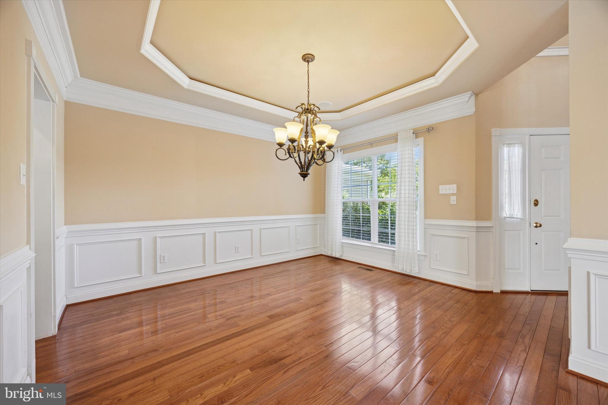 13 Ashtree Lane Malvern, PA 19355 - Photo 2 of 29 a view of an empty room with window and wooden floor