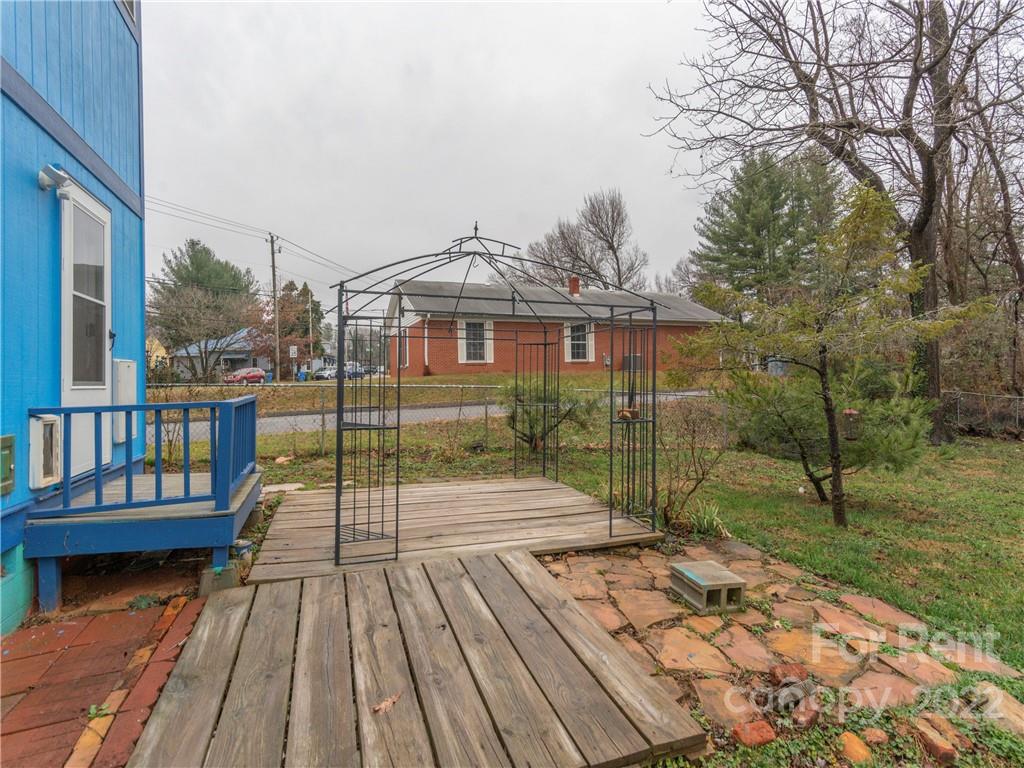 841 Haywood Road Asheville, NC 28806 - Photo 21 of 31 a view of a house with a porch