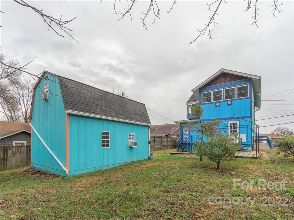 841 Haywood Road Asheville, NC 28806 - Photo 26 of 31 a view of a house with a yard
