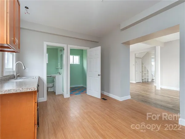close up of air conditioner sitting next to a window