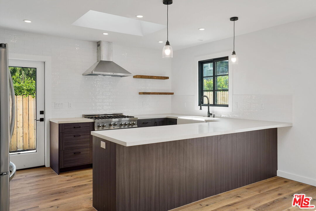 4130 Verdugo View Drive Los Angeles, CA 90065 - Photo 13 of 36 a kitchen with a stove a sink and a refrigerator