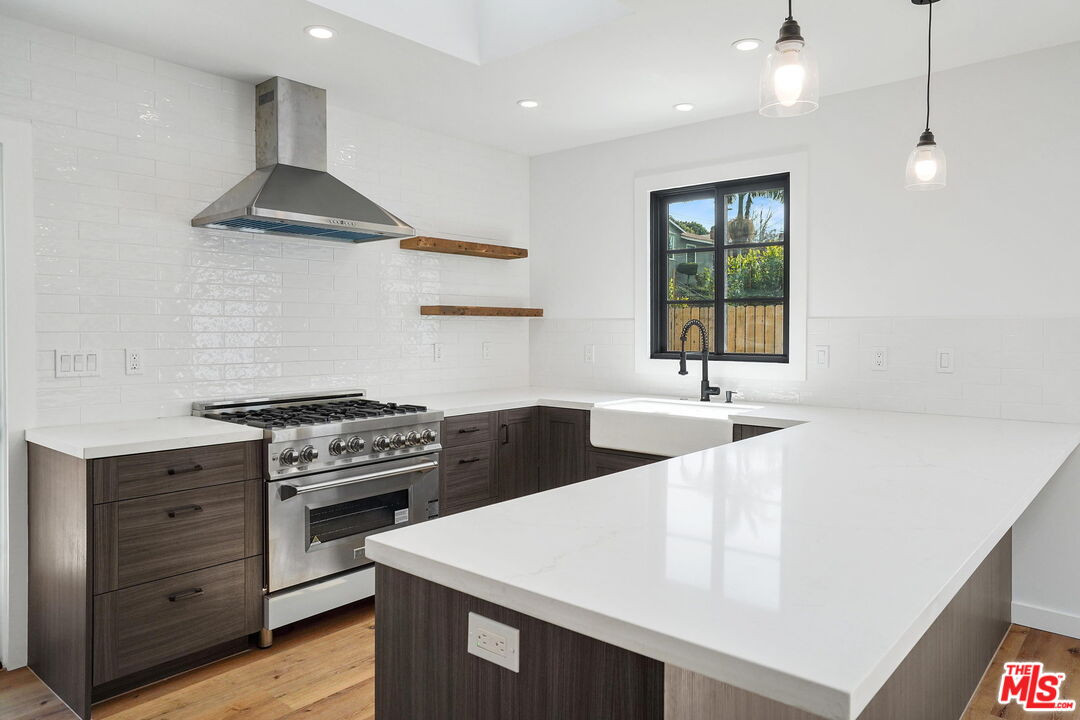 4130 Verdugo View Drive Los Angeles, CA 90065 - Photo 16 of 36 a kitchen with stainless steel appliances a sink stove and cabinets