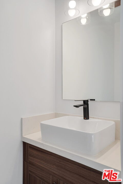 4130 Verdugo View Drive Los Angeles, CA 90065 - Photo 26 of 36 a bathroom with a sink and a mirror