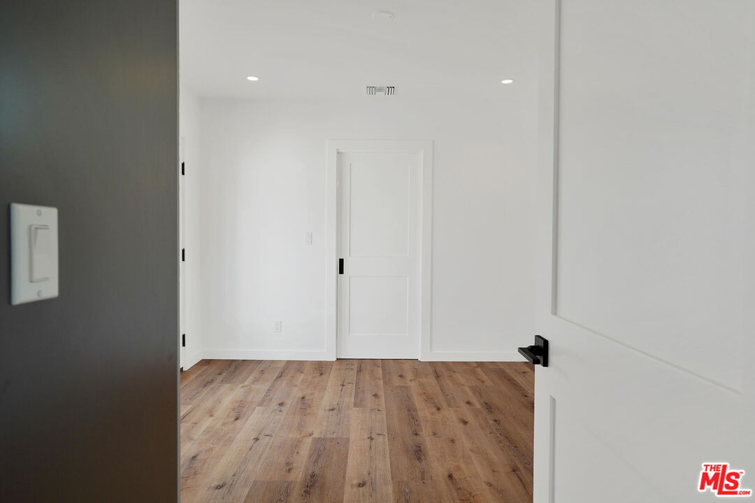 4130 Verdugo View Drive Los Angeles, CA 90065 - Photo 27 of 36 an empty room with wooden floor