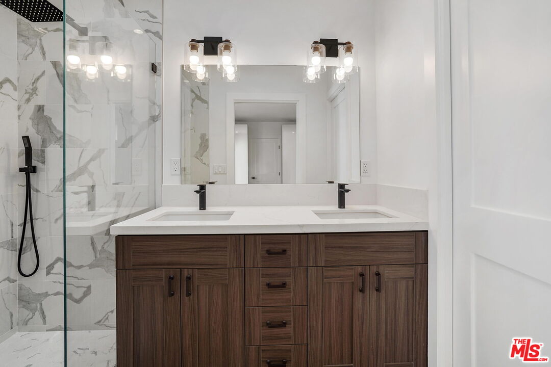 4130 Verdugo View Drive Los Angeles, CA 90065 - Photo 30 of 36 a bathroom with a sink double vanity and a mirror