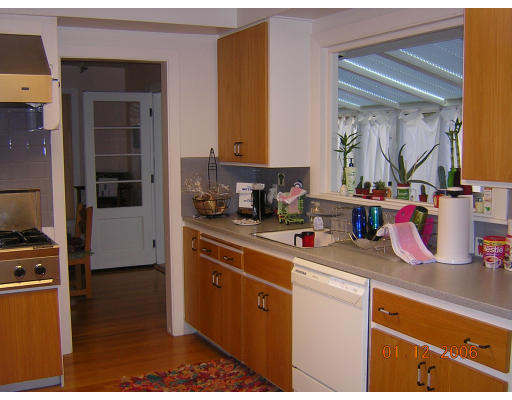 91 Walnut Hill Road Brookline, MA 02467 - Photo 5 of 14 a kitchen with stainless steel appliances granite countertop a sink stove and cabinets