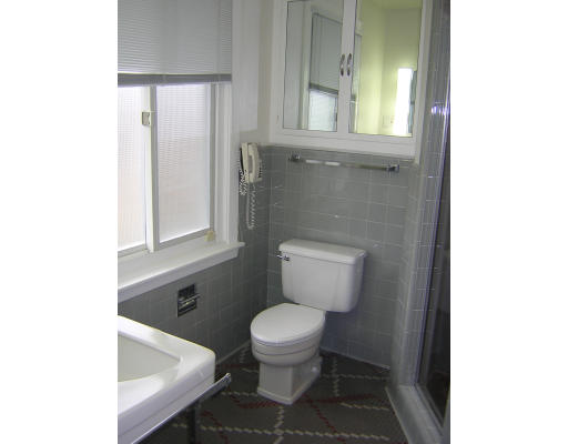 91 Walnut Hill Road Brookline, MA 02467 - Photo 8 of 14 a bathroom with a toilet a sink and a window