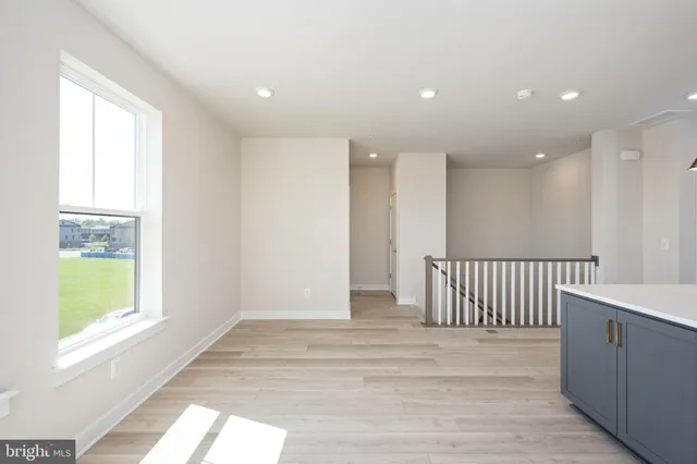 a view of a hallway with windows