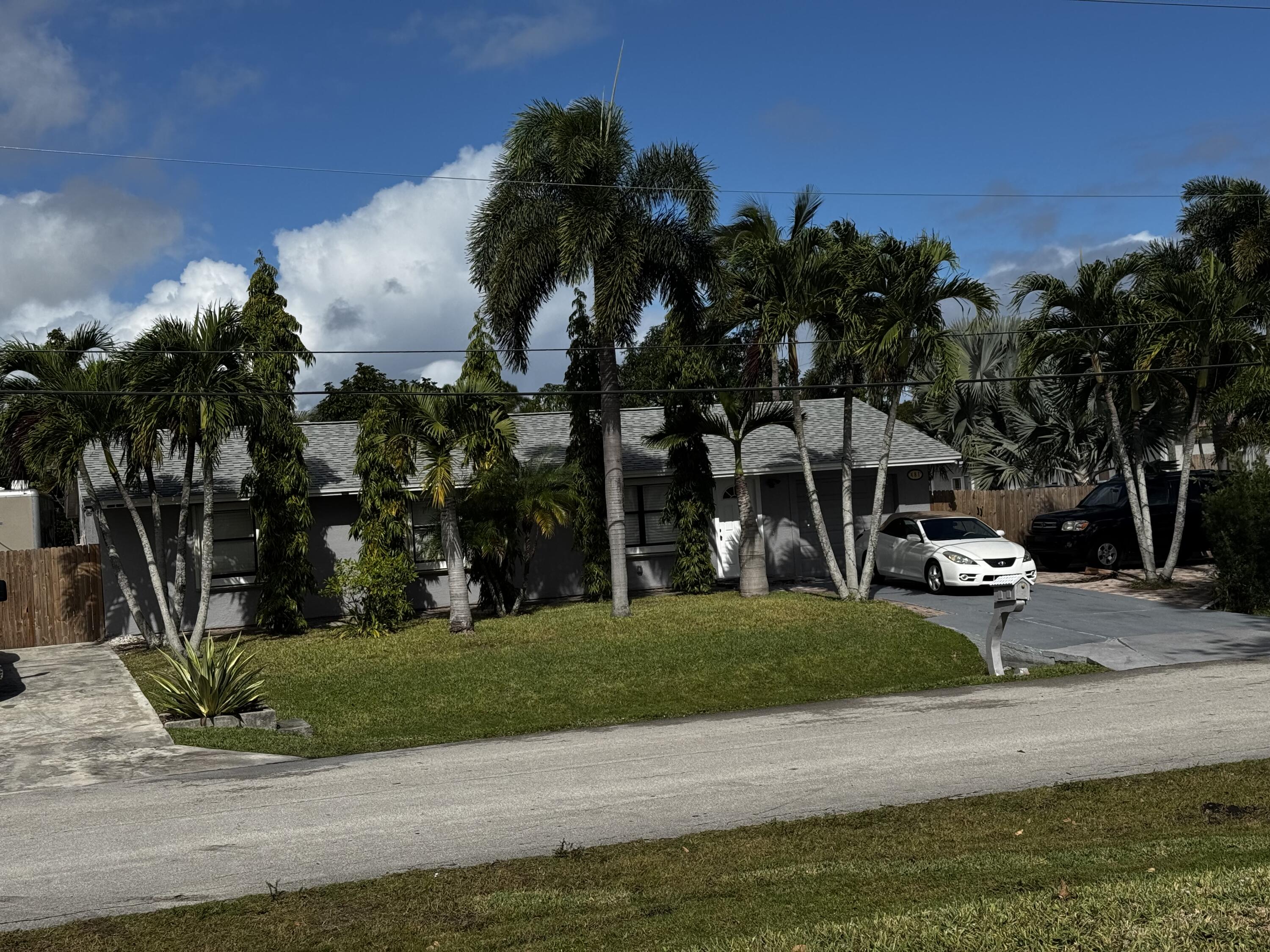 1892 Southwest Biltmore Street Port St. Lucie, FL 34984 - Photo 4 of 11 a view of a park with plants and palm trees