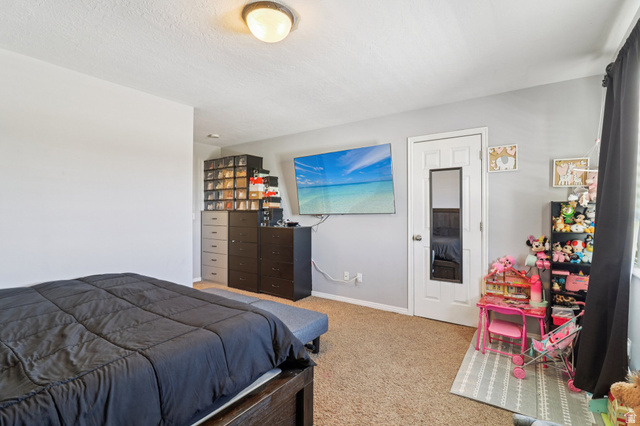 1077 South 1850th Street West Springville, UT 84663 - Photo 14 of 22 Carpeted bedroom with baseboards