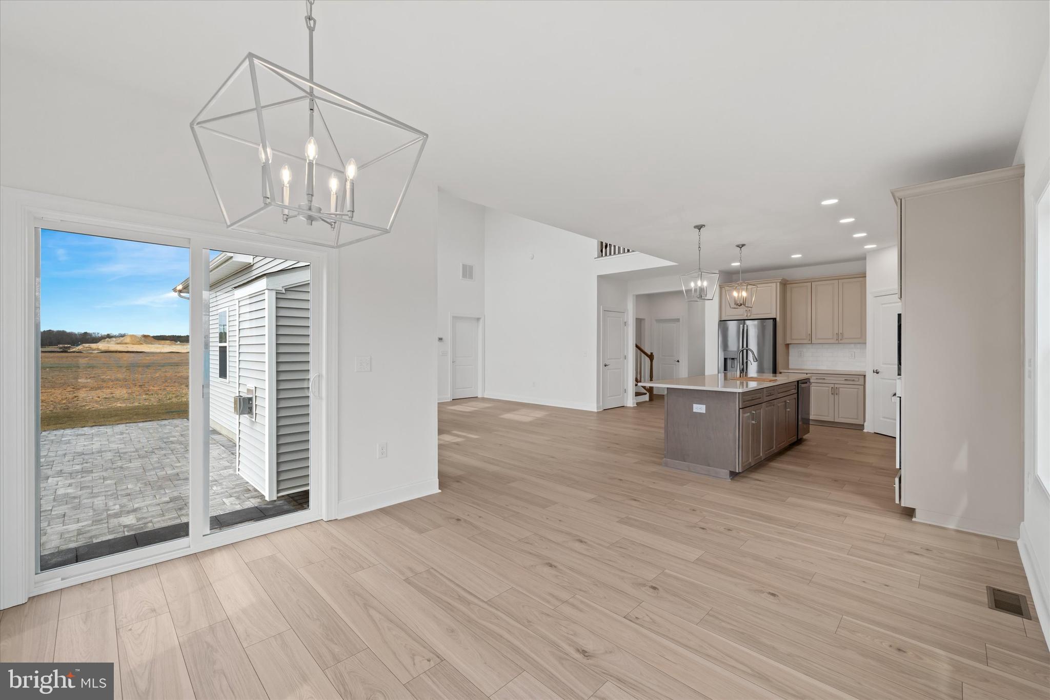 25246 Bethesda Road Georgetown, DE 19947 - Photo 15 of 41 a view of kitchen and dining room with wooden floor