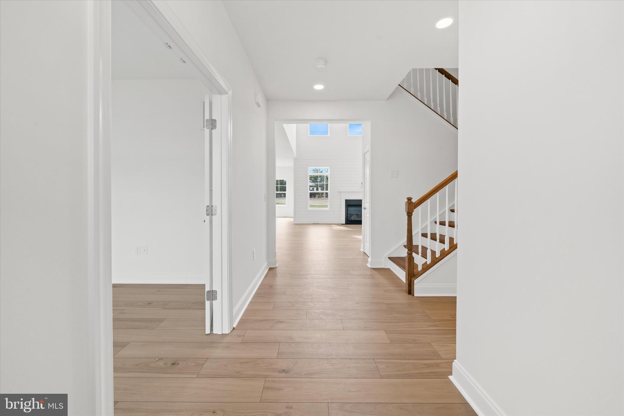 25246 Bethesda Road Georgetown, DE 19947 - Photo 5 of 41 a hallway with wooden floor