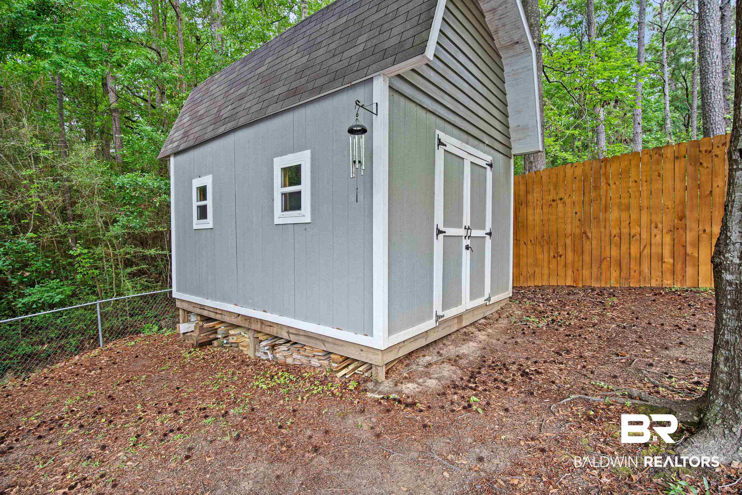 71 Caisson Trace Daphne, AL 36527 - Photo 35 of 36 Detached storage shed with a gambrel roof and double entry doors