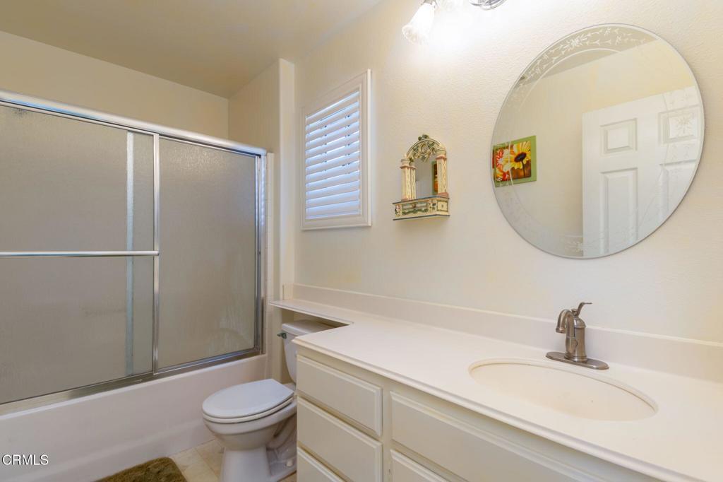 623 Novato Drive Oxnard, CA 93035 - Photo 16 of 22 a bathroom with a sink a toilet and a mirror