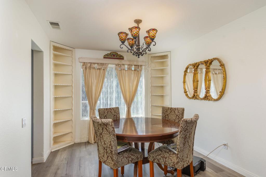 623 Novato Drive Oxnard, CA 93035 - Photo 5 of 22 a view of a dining room with furniture and wooden floor