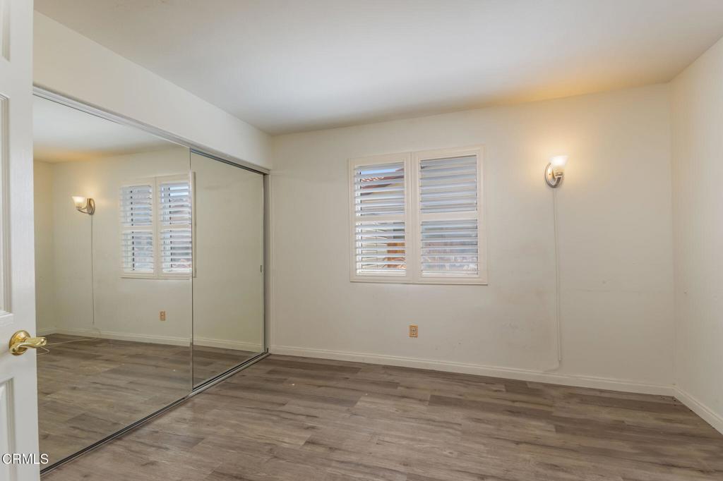 623 Novato Drive Oxnard, CA 93035 - Photo 8 of 22 an empty room with wooden floor and windows
