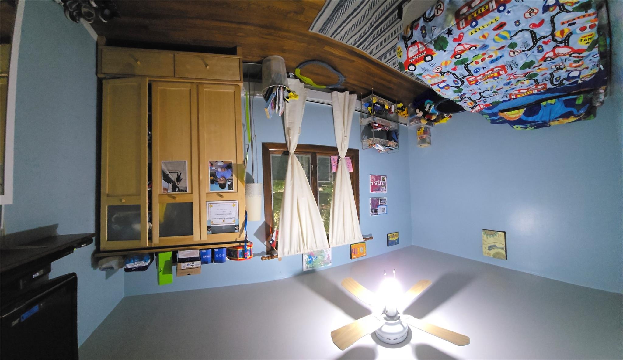 204-19 46th Road Queens, NY 11361 - Photo 11 of 23 a bedroom with a bed and a chandelier