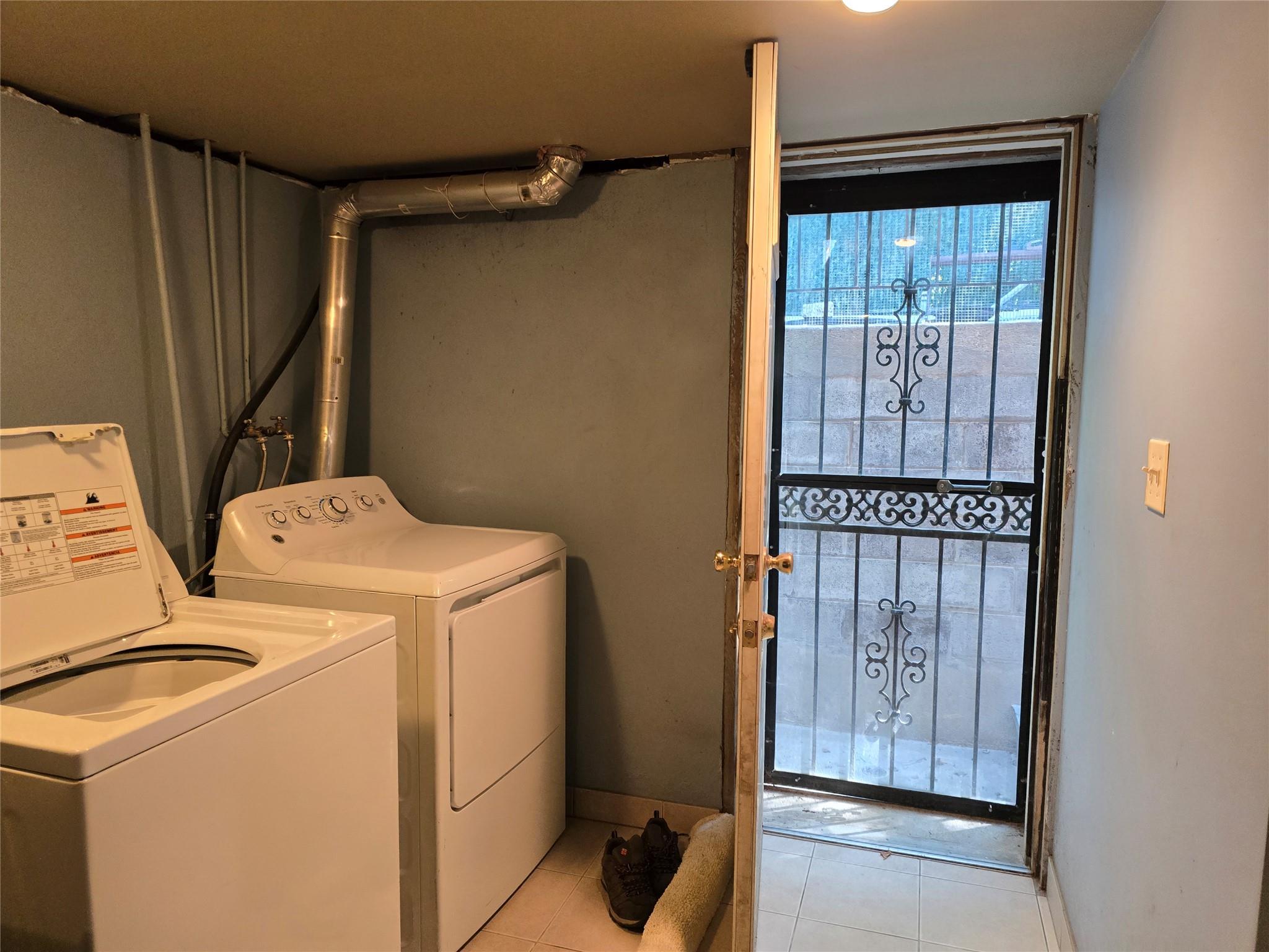 204-19 46th Road Queens, NY 11361 - Photo 18 of 23 a utility room with dryer and washer