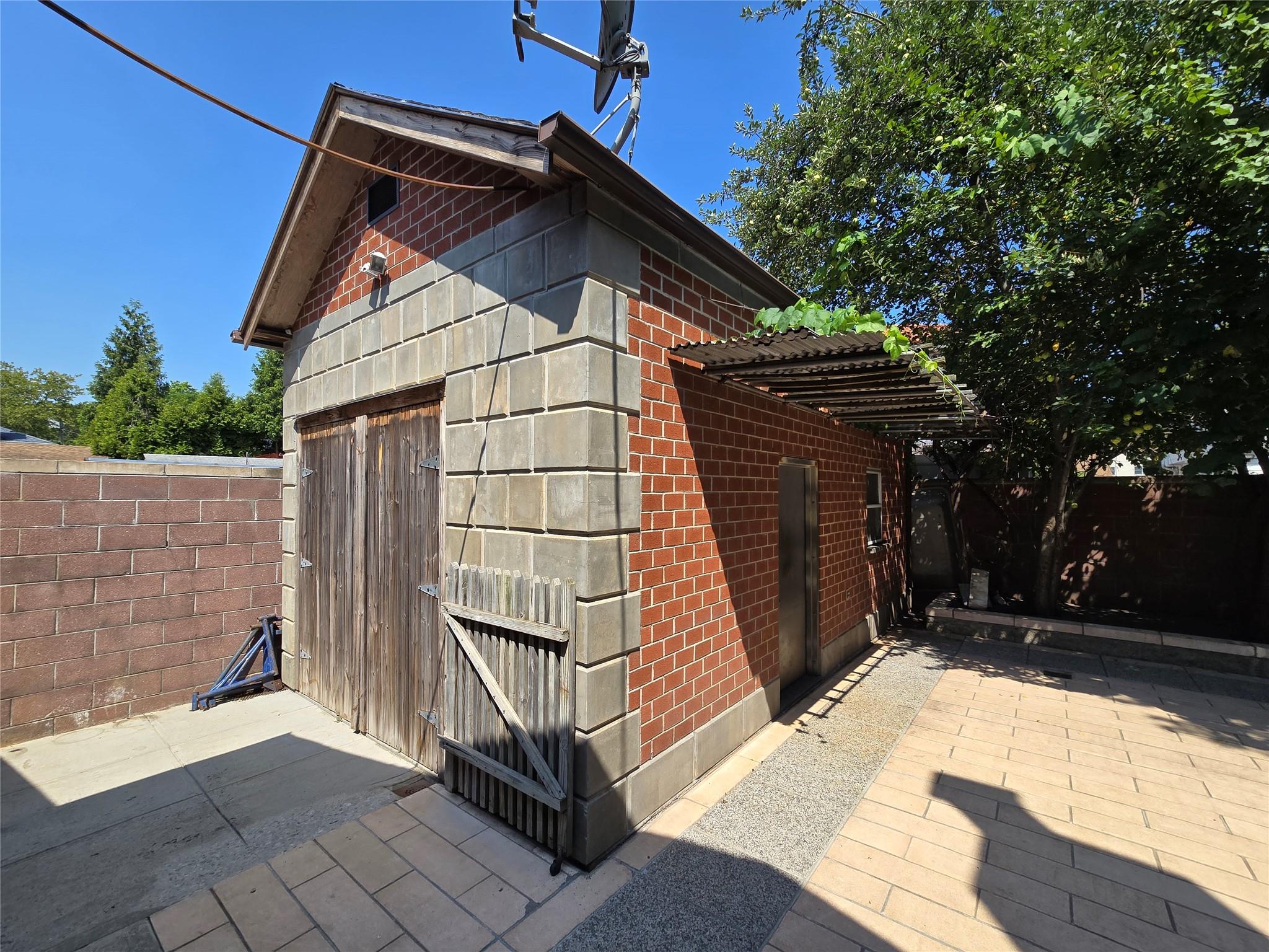 204-19 46th Road Queens, NY 11361 - Photo 20 of 23 a view of wooden house with a large window