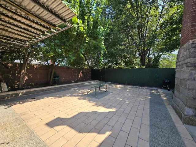 a living room with a fireplace and windows