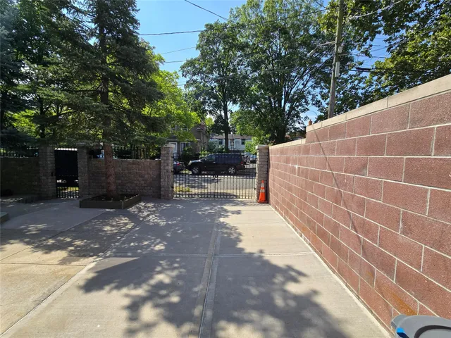 a view of backyard with outdoor seating and plants