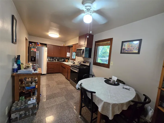a kitchen with sink cabinets and appliances
