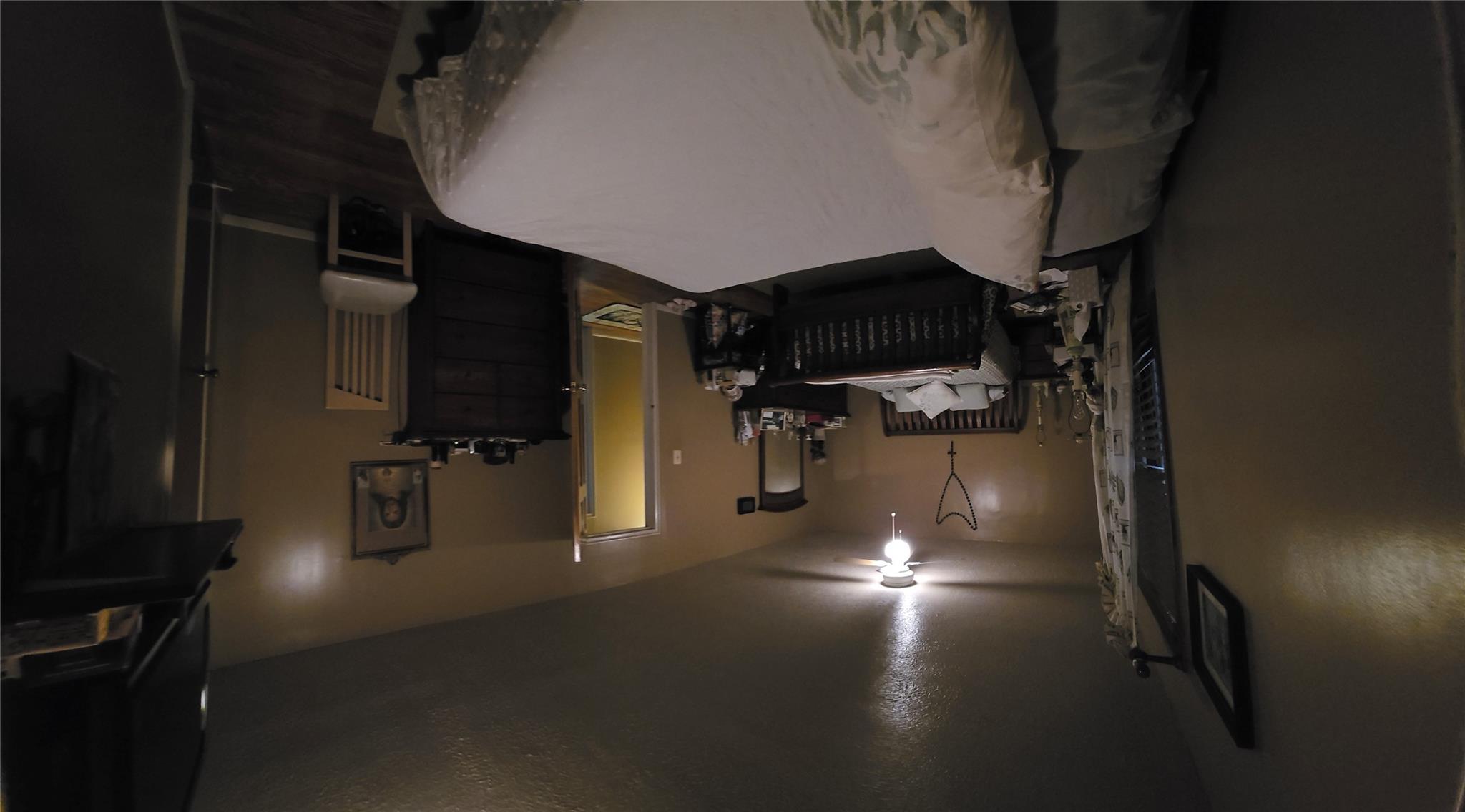 204-19 46th Road Queens, NY 11361 - Photo 8 of 23 a bed room with a bed and a chair