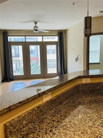 a front view of a house with a large window and a rug