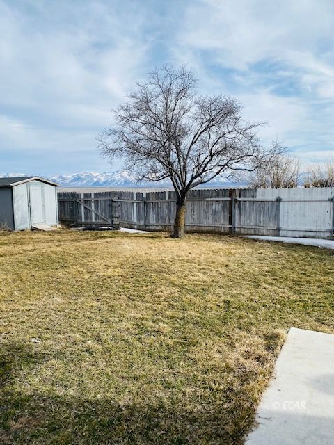 562 Spring Valley Parkway Spring Creek, NV 89815 - Photo 13 of 29 a view of a swimming pool with an outdoor seating