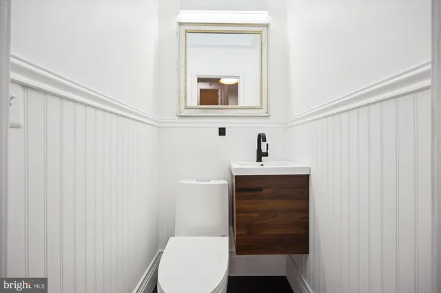 a bedroom with a bed couch and window