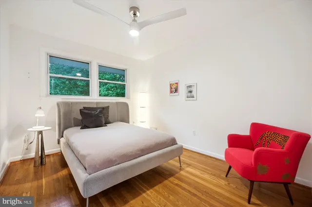 a bathroom with a toilet and a shower curtain