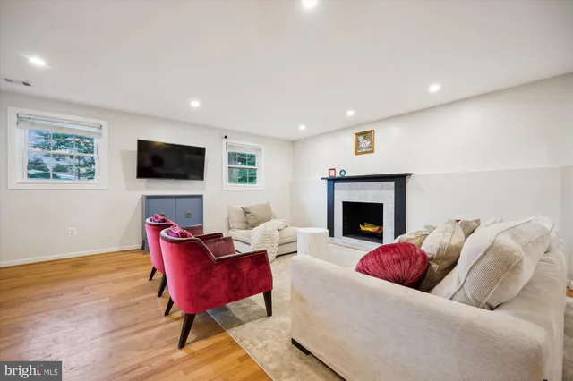 a living room with furniture and a washer dryer