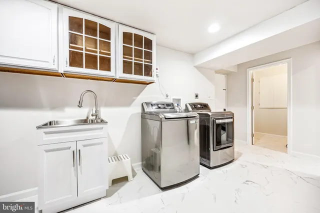 a view of a house with swimming pool and sitting area