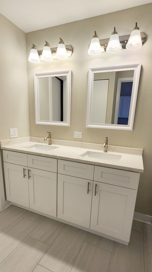 333 West Hubbard Street, Unit 607 Chicago, IL 60654 - Photo 9 of 15 a bathroom with a sink and a mirror