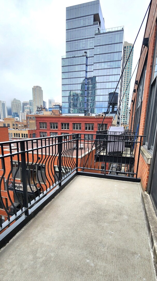 333 West Hubbard Street, Unit 607 Chicago, IL 60654 - Photo 12 of 15 a view of a balcony with furniture