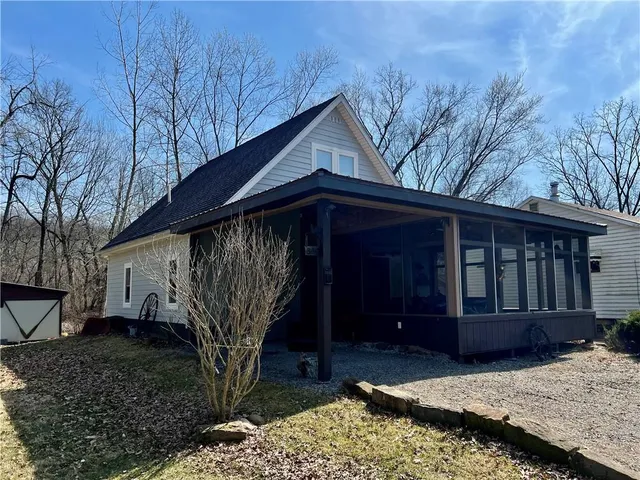 a house view with a backyard space