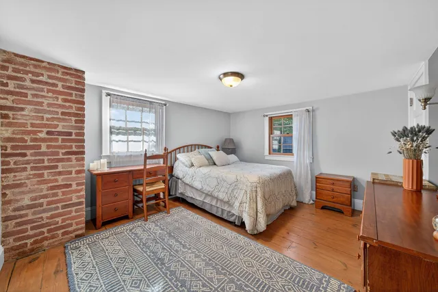 a bedroom with a bed and furniture