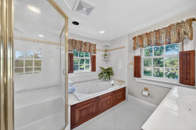 a bathroom with a bathtub and a sink