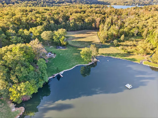 a view of a lake with a yard