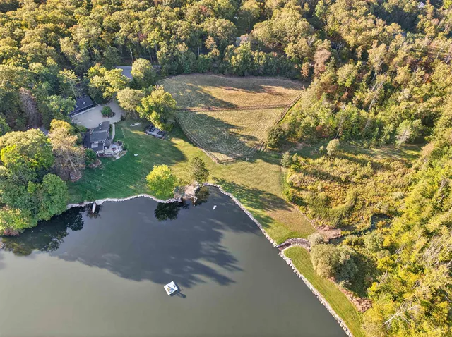 a vase of flowers sitting on a floor