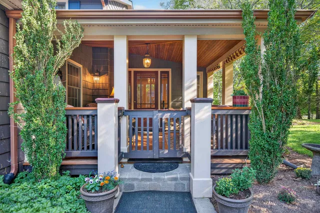 a front view of house and yard with green space