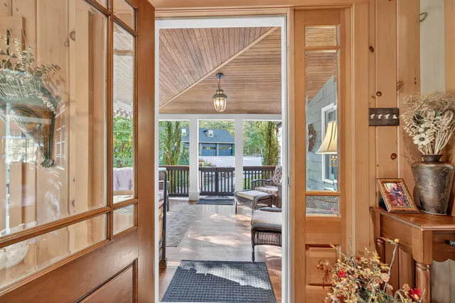 a porch with a glass door and glass door