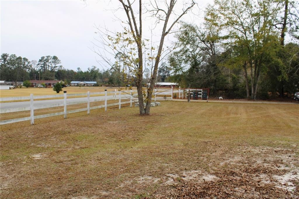 125 Trailwood Road Valdosta, GA 31602 - Photo 14 of 19 a view of a lake with houses