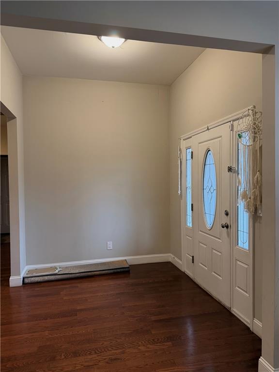 125 Trailwood Road Valdosta, GA 31602 - Photo 3 of 19 an empty room with wooden floor mirror and windows