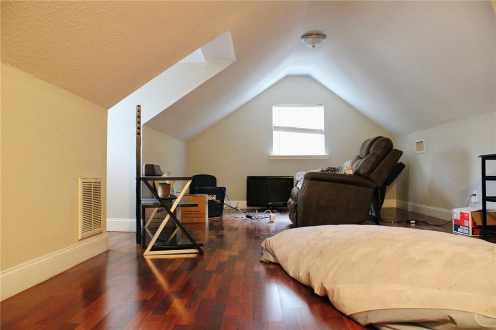 125 Trailwood Road Valdosta, GA 31602 - Photo 8 of 19 a bedroom with bed and wooden floor